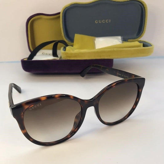 GUCCI GG0636SK 002 round Gucci sunglass comes in a dark havana frame with