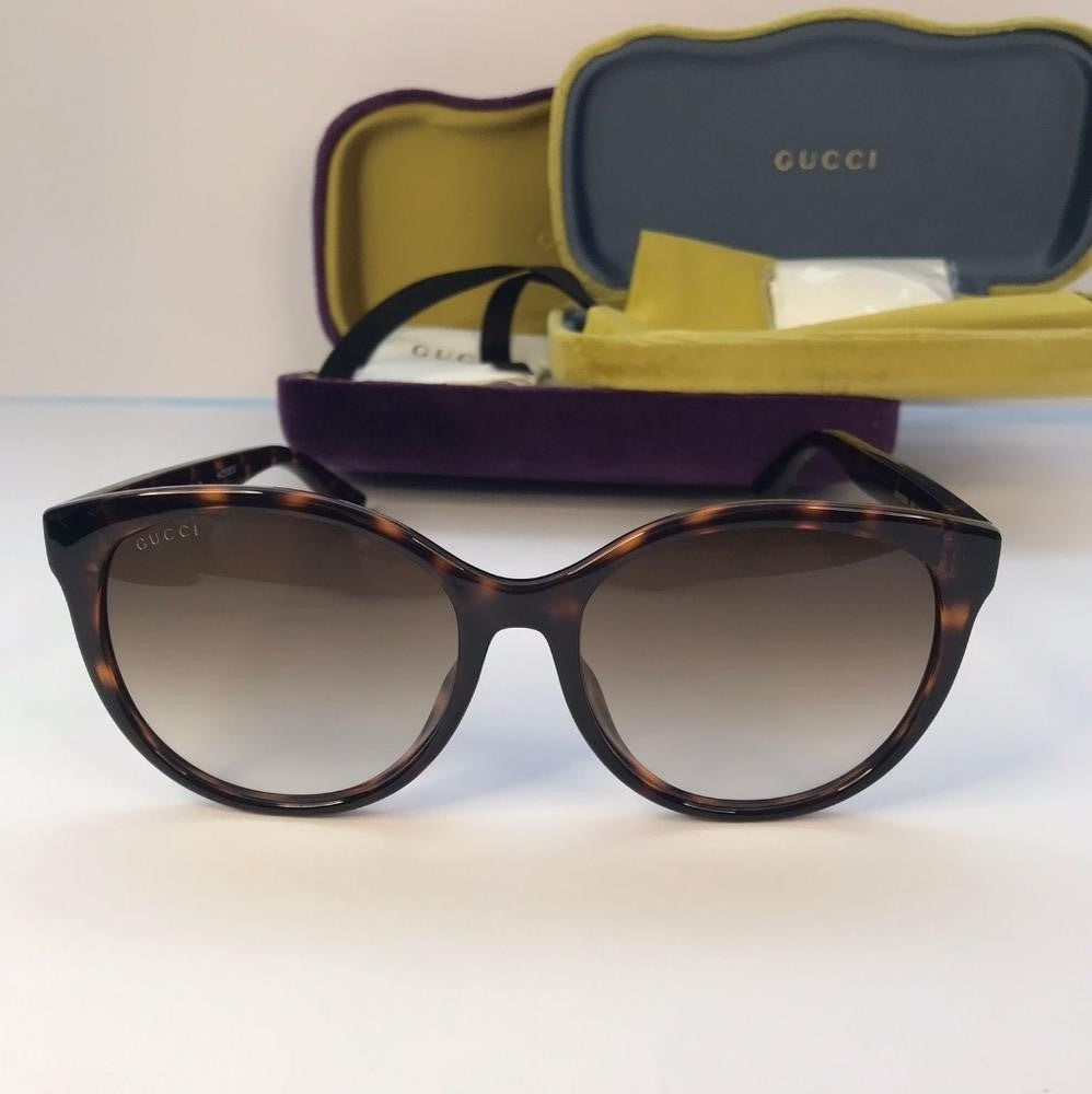 GUCCI GG0636SK 002 round Gucci sunglass comes in a dark havana frame with