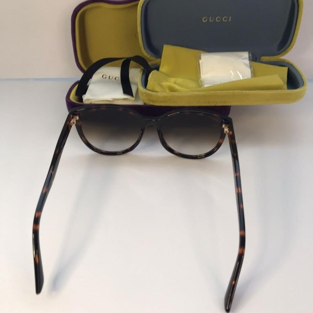 GUCCI GG0636SK 002 round Gucci sunglass comes in a dark havana frame with