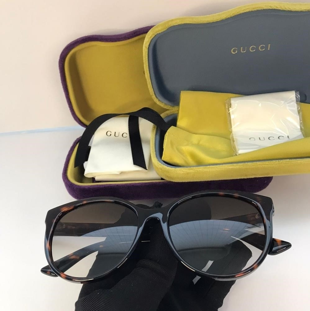 New - GUCCI GG0636SK 002 round Gucci sunglass comes in a dark havana frame with